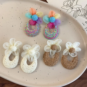Handmade woven floral drop earrings set in rainbow, cream, and brown for summer holidays