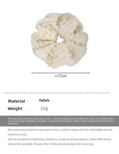 Detailed view of cream lace scrunchie showing 17cm diameter and fabric material details