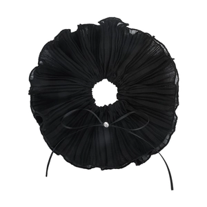 Macro shot of black pleated chiffon hair scrunchie with crystal rhinestone bow detail