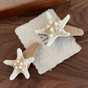 Natural starfish hair clips set with raffia base for bohemian beach vacation style