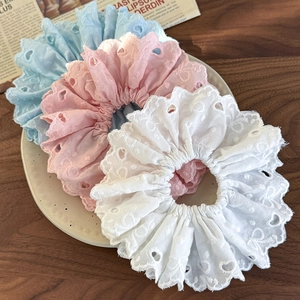 Set of three embroidered lace scrunchies in pastel pink blue and white colors