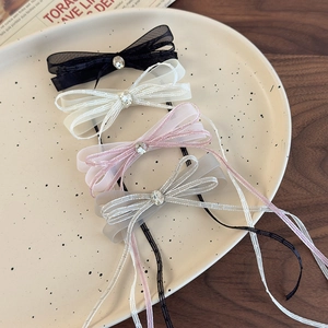 Set of four mesh ribbon bow hair clips with rhinestones and long tassels in various colors