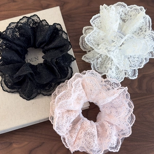 Three-piece lace scrunchie set in black, white, and nude pink with elegant embroidery