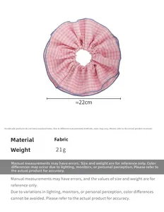 Pink checkered scrunchie with blue ruffled edges showing 22cm diameter and fabric detail