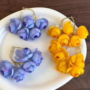 Elegant floral tassel earrings with blue and yellow fabric petals and white pearls