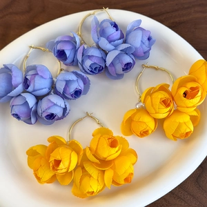 Floral hoop earrings with pearls and fabric petals in light blue and yellow colors