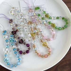 Handmade beaded phone strap featuring crystal flowers and butterfly charms in vibrant colors