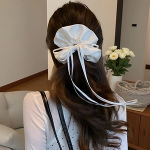 Elegant white satin scrunchie with long ribbons for ballet style ponytail hairstyles