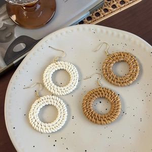 Bohemian large round woven straw earrings in cream and natural brown with gold hooks