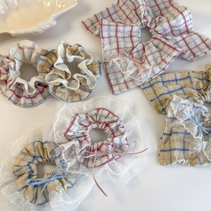 Sweet plaid scrunchies with white lace trim and delicate bowknots for women