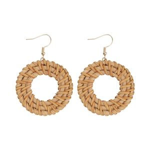 Bohemian round straw woven hoop earrings with gold metal hooks on white background