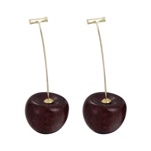 Deep red resin cherry earrings with golden shimmer and metal stems on white background