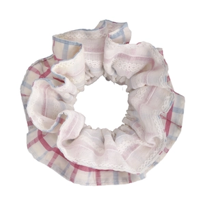 Plaid lace scrunchie with pink blue grid pattern and delicate white ruffled edges