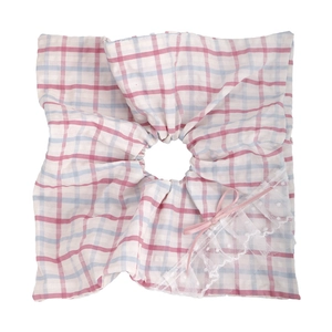 Close-up of oversized red and blue plaid scrunchie with white lace trim and pink ribbon bow