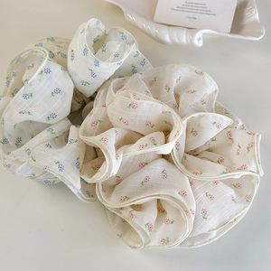 Floral chiffon scrunchie set with blue and pink patterns on a soft white background