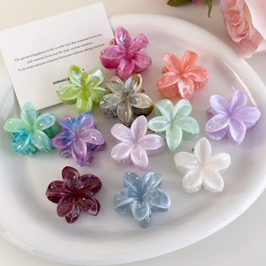 Set of 13 colorful plumeria flower hair clips with marble patterns for women