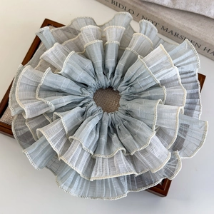Detailed view of grey blue multi-layered wavy lace scrunchie with sheer chiffon fabric