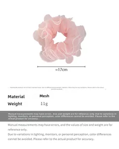 Detail view of light pink mesh scrunchie with dot pattern and 17cm diameter specification