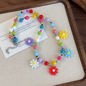 Colorful beaded daisy necklace with acrylic flower pendants and adjustable silver clasp