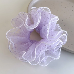 Detail of lavender mesh scrunchie with polka dots and white wave stitched edges