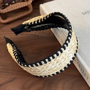 Detail of bohemian straw headband showing woven texture and inner non-slip grip