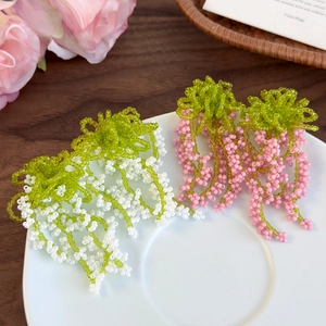 Handmade green beaded tassel fruit drop earrings with floral crown design for vacation