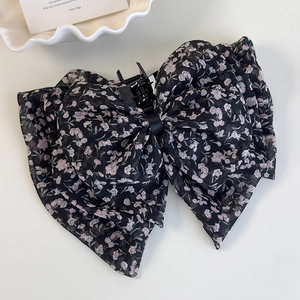 Detailansicht der großen Haarklammer mit floraler Chiffon-Schleife für Frisuren