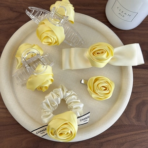 5-piece elegant yellow rose hair accessory set featuring satin bows and acrylic clips