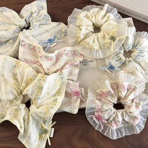 Floral print hair scrunchies with lace edges and handmade decorative buttons