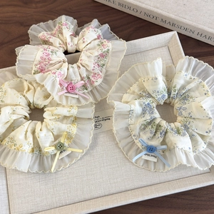 Floral lace scrunchie set with bow and button detail in pink yellow and blue colors