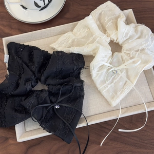Lace bow scrunchies set in black and cream colors with sparkling rhinestone detail