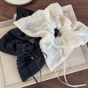 Elegant lace hair scrunchie with polka dot tulle bow and sparkling rhinestone detail