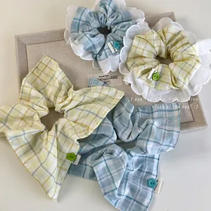 Lace plaid scrunchies with flower buttons and handmade labels in pastel colors