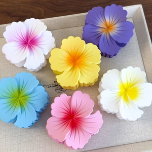 Set of frosted gradient plumeria flower hair claws in six vibrant colors for summer