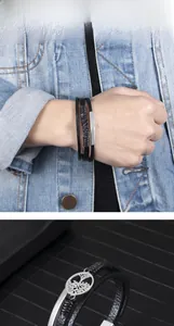 Macro detail of multilayer braided leather bracelet with silver tree of life metal charm