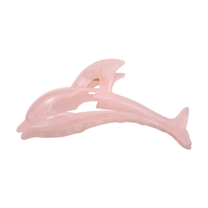 Macro detail of a translucent pink dolphin hair claw clip with a pearlescent finish