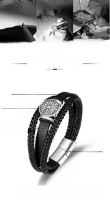 Detail of Viking Vegvisir compass charm on multilayer braided leather bracelet for men