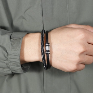 Men's double-layered black braided leather bracelet with polished silver magnetic clasp