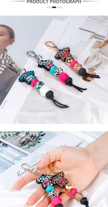 Detail of leopard print silicone bead keychain with medical scrub life charm pendant