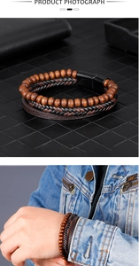 Macro detail of men's multilayer bracelet featuring wood beads and leather with magnetic clasp