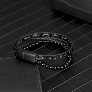 Men's minimalist black woven leather bracelet with hematite beads and magnetic clasp