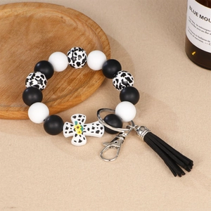 Silikon-Perlenarmband Schlüsselanhänger mit Kuhmuster, Kreuzanhänger und schwarzen Quasten