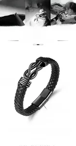 Detail of black braided leather bracelet with stainless steel knot clasp, 21cm length