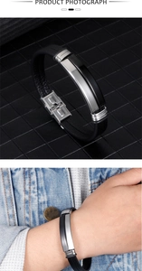 Detail of multi-layer leather bracelet with stainless steel clasp and engraved metal elements