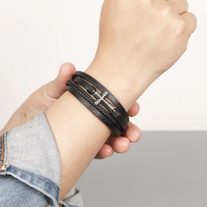 Men's multilayer black braided leather bracelet featuring a vintage silver cross charm