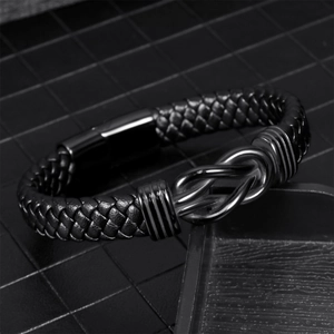 Men's black braided leather bracelet with stainless steel knot and magnetic clasp