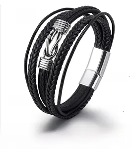 Detail view of multi-layer black leather bracelet with silver infinity clasp, 21cm length