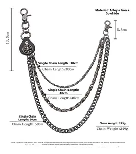 Detail of vintage punk trouser chain featuring skull charm and multi-layered metal links