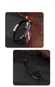 Dettaglio dei bracciali in pelle intrecciata con emblema a croce e chiusura magnetica