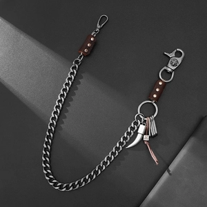 Vintage heavy curb chain pant accessory with leather accents and horn pendant decoration